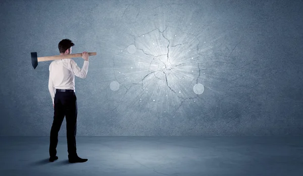 Business man hitting wall with a hammer — Stock Photo, Image