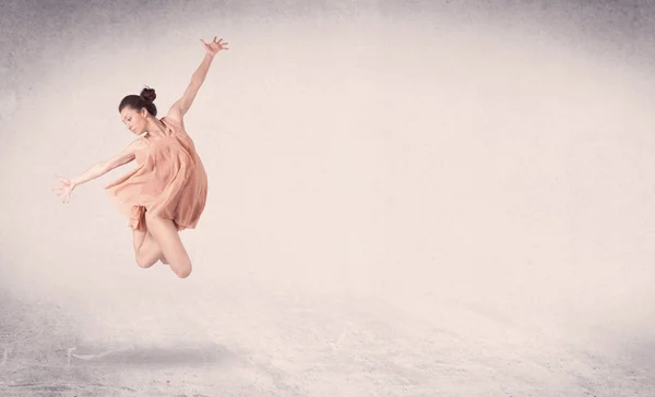 Modern ballet dancer performing art jump with empty background — Stock Photo, Image