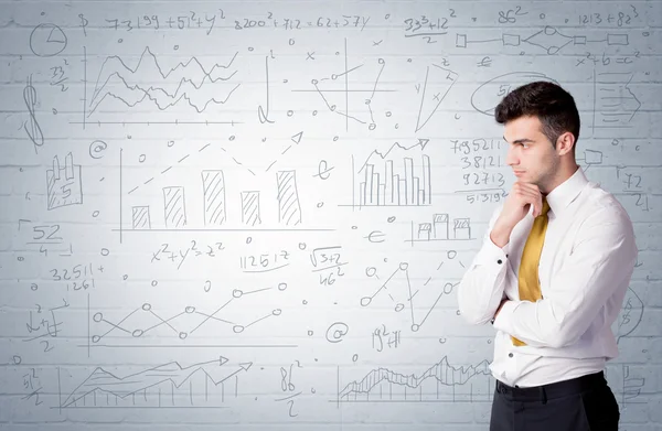 Salesman standing with drawn graph charts — Stock Photo, Image