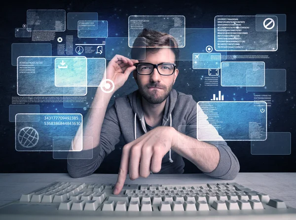 Nerd with glasses hacking websites — Stock Photo, Image