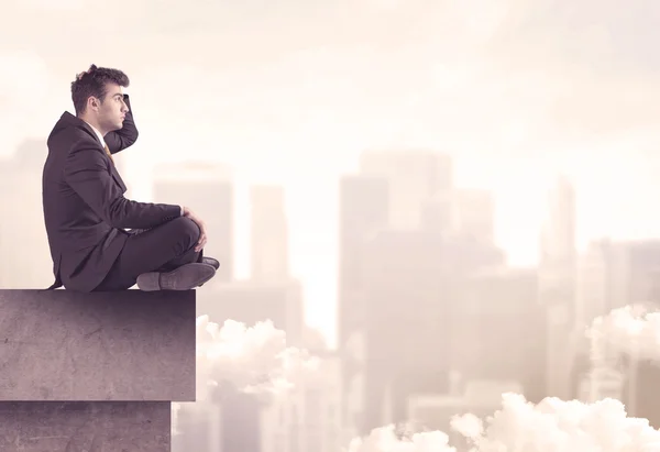 Peaceful sales guy sitting on roof top — Stock Photo, Image