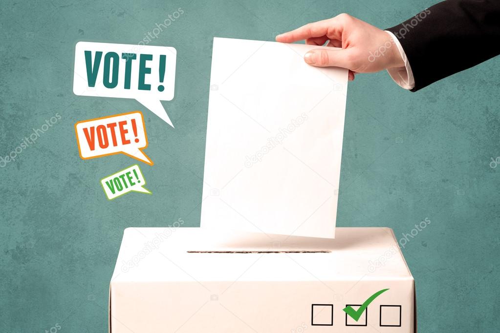 placing a voting slip into a ballot box