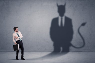 Business man looking at his own devil demon shadow concept clipart