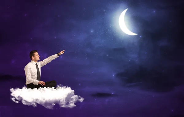 Muž sedí na mrak — Stock fotografie