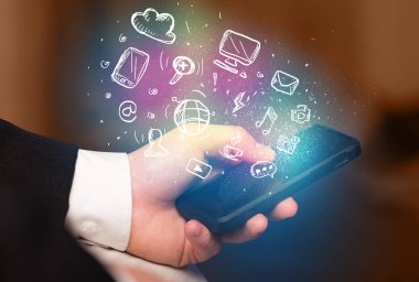 El smartphone Medya simgeler ile tutarak 
