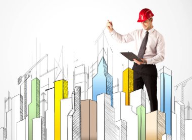 İş adamı şehir manzarası çiziyor