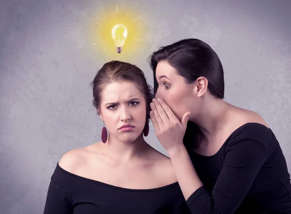 Girl telling secret things to her girlfriend — Stock Photo, Image