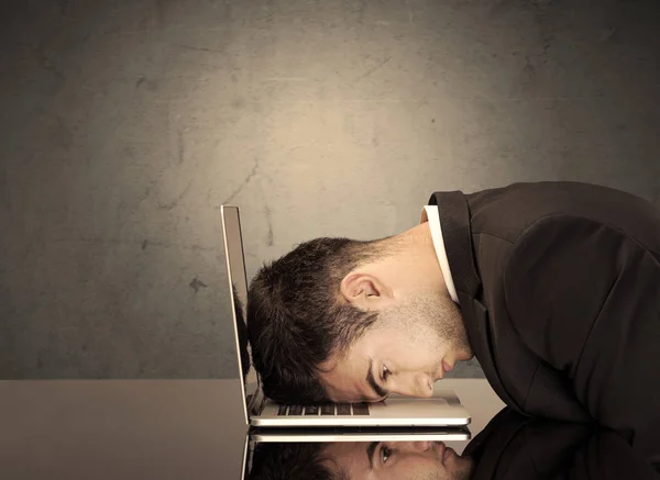 Frustrated businessman's head on keyboard — Stock Photo, Image