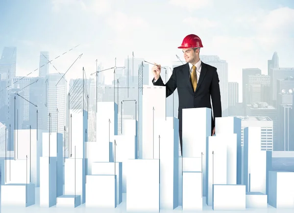 Businessman drawing skyscrapers — Stock Photo, Image