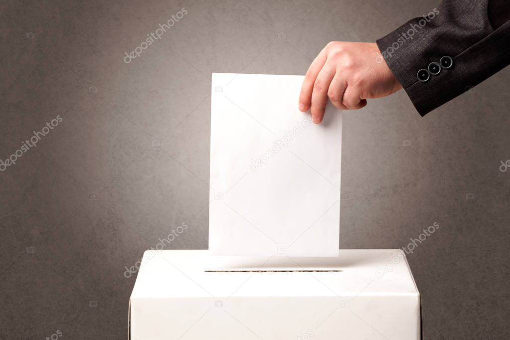 Ballot box with person casting vote 