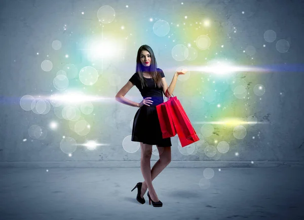 Mall lady with shopping bags and glitter light — Stock Photo, Image