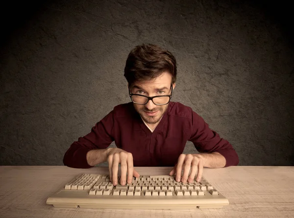 Computer geek typing on keyboard — Stock Photo, Image