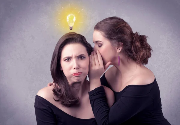 Girl telling secret things to her girlfriend — Stock Photo, Image