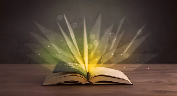 Yellow lights over book — Stock Photo, Image
