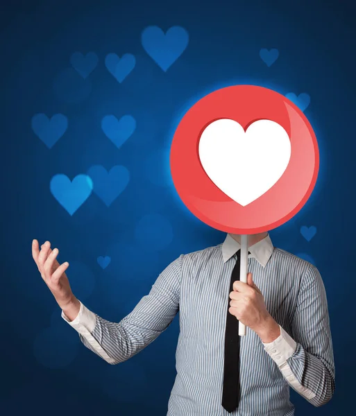 Businessman holding heart sign — Stock Photo, Image