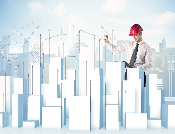 Businessman drawing skyscrapers — Stock Photo, Image