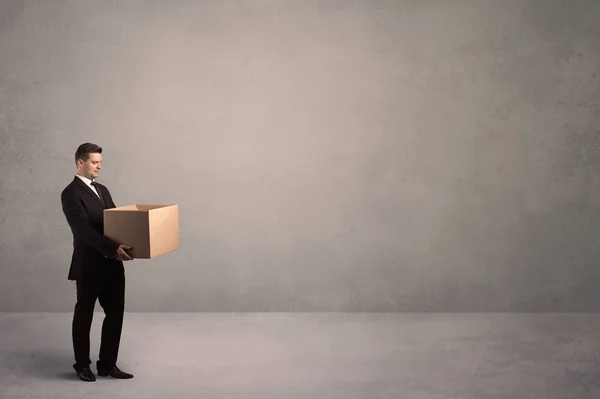 Businessman with empty box — Stock Photo, Image