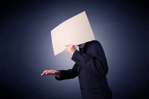 Businessman holding blank paper — Stock Photo, Image