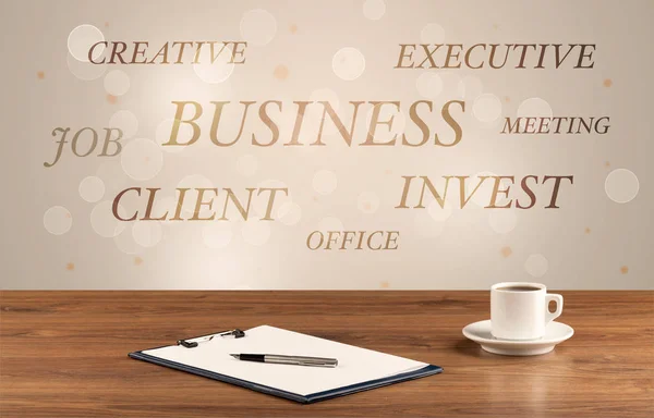Business office desk with writing on wall — Stock Photo, Image