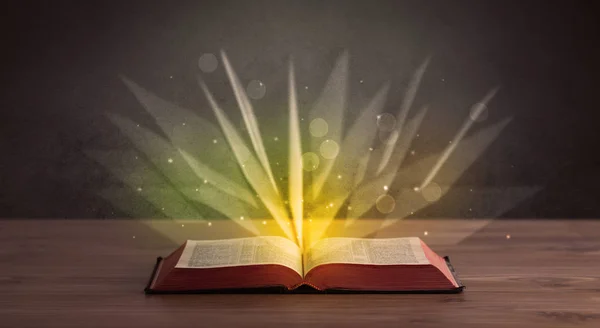 stock image Yellow lights over book 