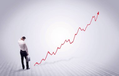 Kırmızı grafik ok ile ayakta işadamı