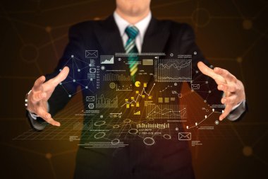 İş planı grafik tutan işadamı 