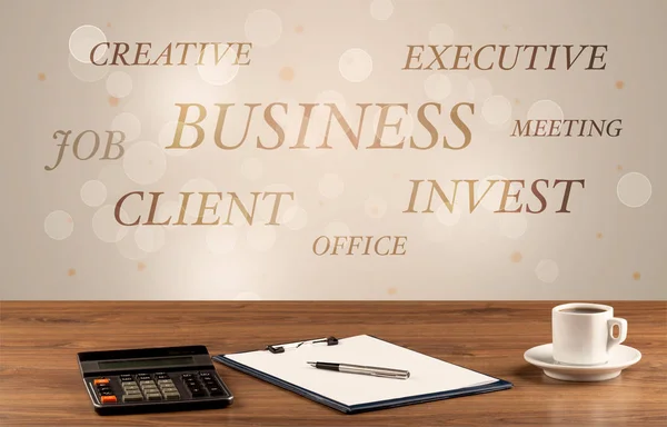 Business office desk with writing on wall — Stock Photo, Image