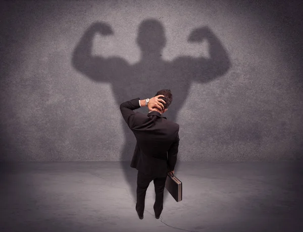 Successful businessman with strong shadow — Stock Photo, Image