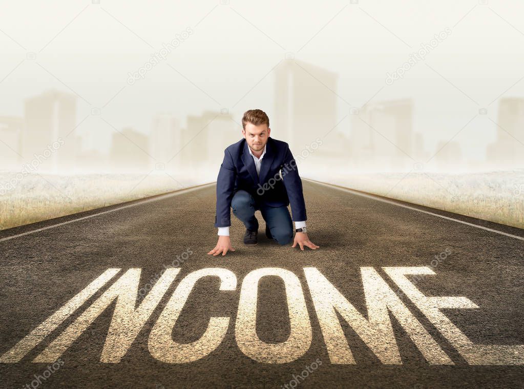 Businessman kneeling in ready position