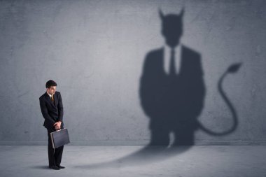 Business man looking at his own devil demon shadow concept clipart
