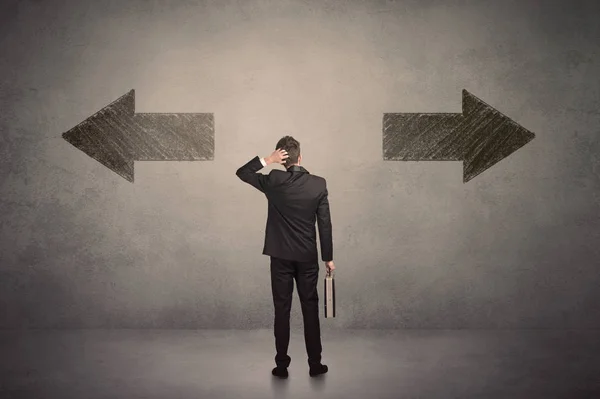 Business man taking a decision while standing in front of two gr — Stock Photo, Image