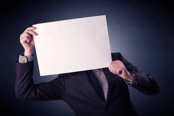 Businessman holding blank paper — Stock Photo, Image