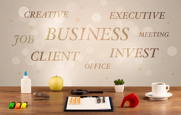 Business office desk with writing on wall — Stock Photo, Image