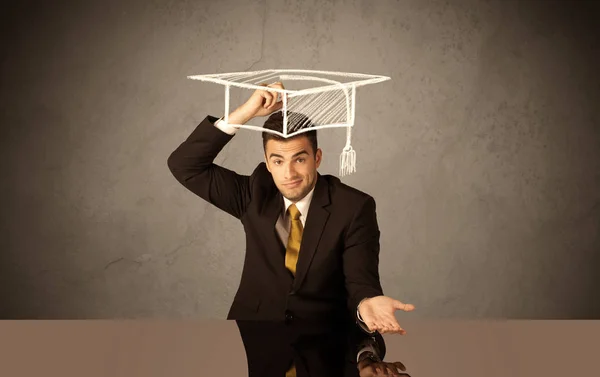 Happy college graduate drawing academic hat — Stock Photo, Image