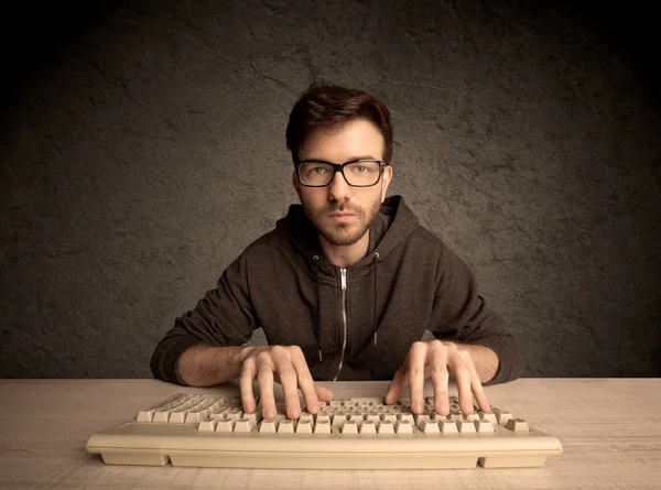 Computer geek typing on keyboard — Stock Photo, Image