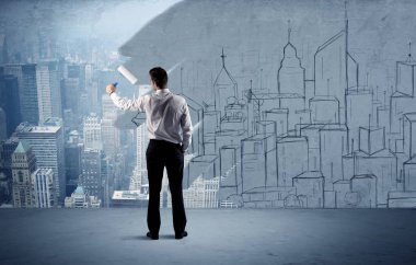 Zarif satıcı şehri duvarda yeniden boyuyor.