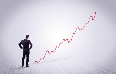 Kırmızı grafik ok ile ayakta işadamı