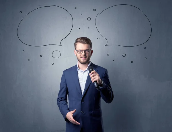 Businessman holding microphone — Stock Photo, Image