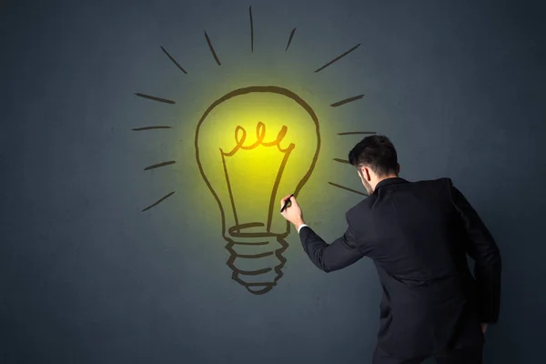 Businessman with lightbulb — Stock Photo, Image