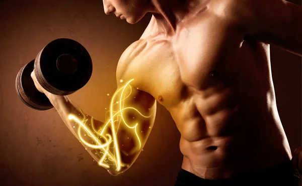 Muscular body builder lifting weight with energy lights on bicep — Stock Photo, Image