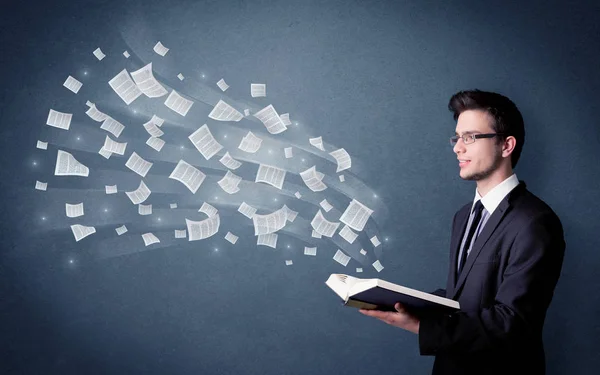 Young man holding book — Stock Photo, Image