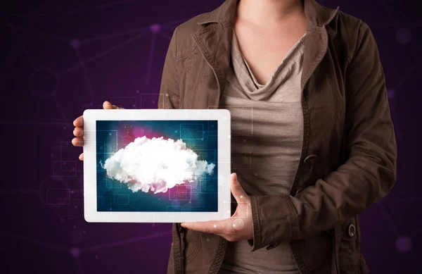 Woman holding tablet with cloud graphic — Stock Photo, Image