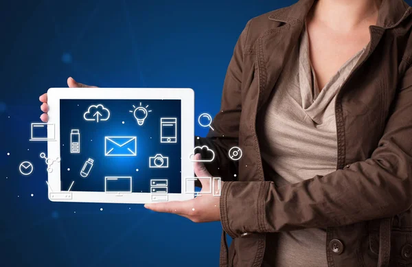 Woman holding tablet with media graphics — Stock Photo, Image