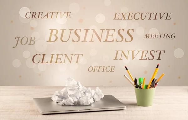 Business office desk with writing on wall — Stock Photo, Image