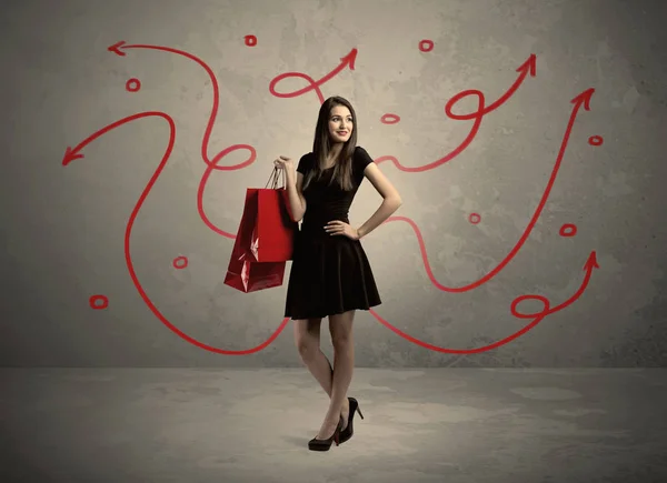 Stylish woman shopping and red arrows — Stock Photo, Image