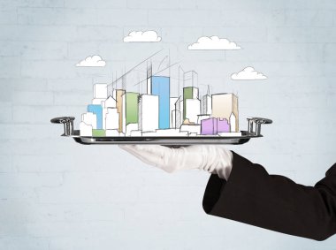 Şehre el ve tepside bulutlar