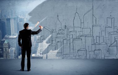 Zarif satıcı şehri duvarda yeniden boyuyor.