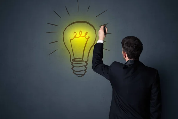 Businessman with lightbulb — Stock Photo, Image