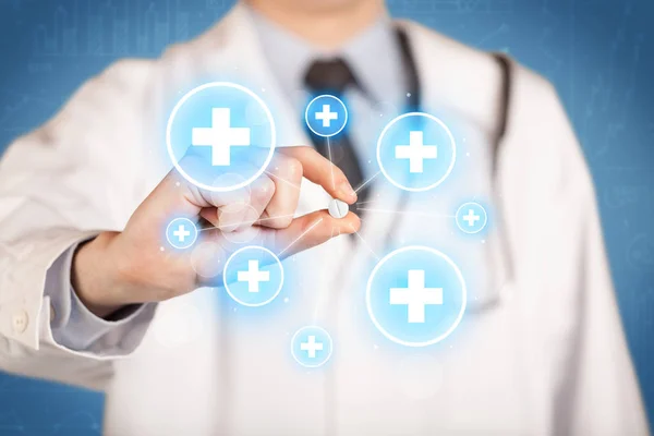 A doctor showing a pill with crosses — Stock Photo, Image