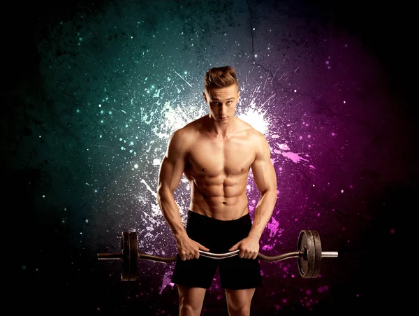 Attractive musculous guy lifting weight — Stock Photo, Image
